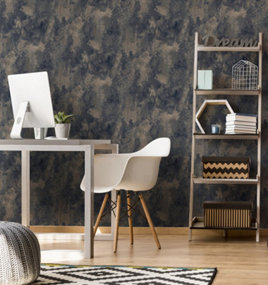 Dark blue and brown abstract print wallpaper in a home office with wooden effect flooring, and a black and white geometric rug.