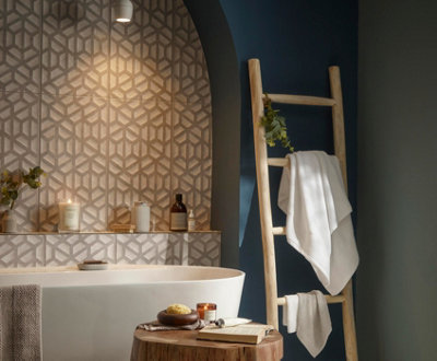 A dark grey bathroom with a brown feature wall.
