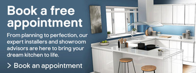 Modern white kitchen with a sleek island and bar stools, featuring a blue accent wall. Text overlay reads: 'Book a free appointment. From planning to perfection, our expert installers and showroom adv