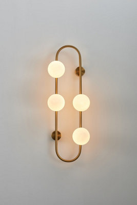 Designer wall lamp sconce, With Gold Finish arm and four smoked white globe glass