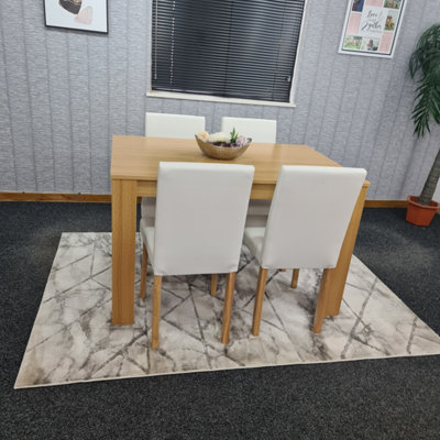 Dining table with cream store leather chairs