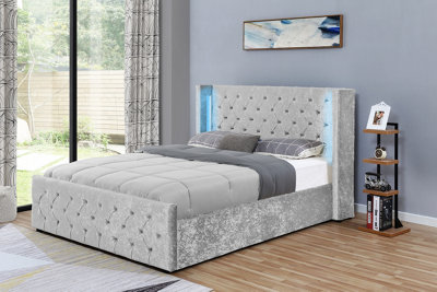 Drogo Silver Crushed Velvet Wingback Ottoman Storage Bed King Size 5FT With Diamante Buttons Colour Changing LED Lights