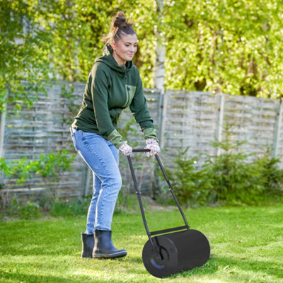 Hand deals lawn roller