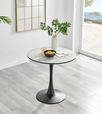 Elina White Marble Effect Round Pedestal Dining Table with Curved Black Support and 2 Green Velvet Pesaro Black Leg Chairs