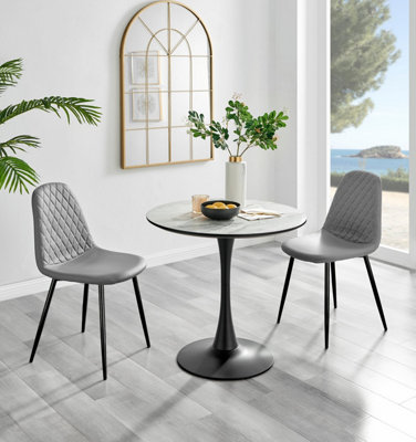 Elina White Marble Effect Round Pedestal Dining Table with Curved Black Support and 2 Grey Faux Leather Corona Black Leg Chairs