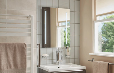 Family bathroom, close-up of the illuminated bathroom mirror.