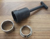 Black plastic shade fitting tool.