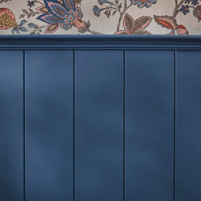 Close up of vertical shiplap panelling painted in blue.