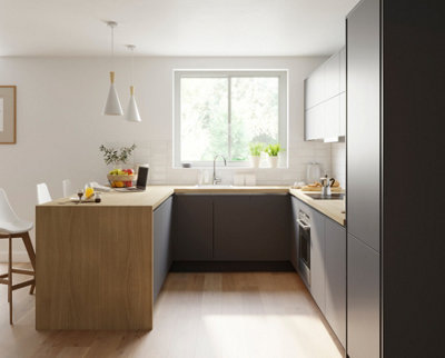 Dark grey and wooden minimalist Scandi kitchen with large window letting in plenty of daylight.