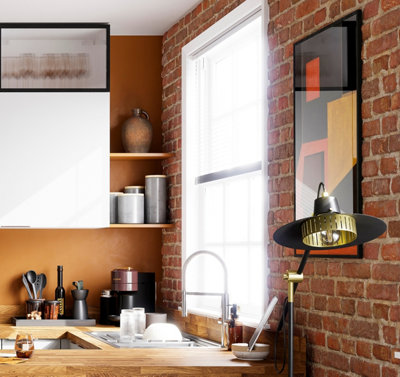 Orange kitchen with wooden floating corner shelves.