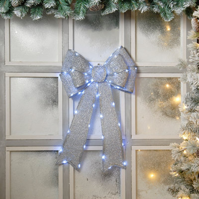 Festive Silver Battery Operated Christmas Door Bow with 84 Warm White LEDs