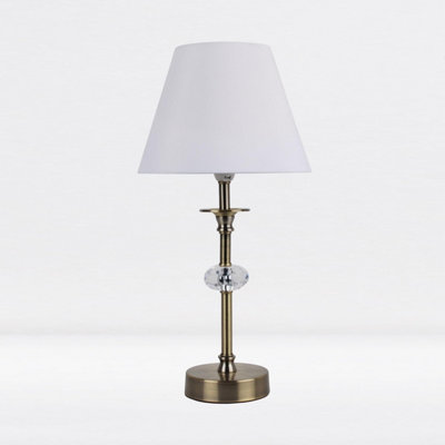 First Choice Lighting Antique Brass Plated Stacked Bedside Table Light Faceted Detail White Fabric Shade