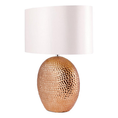 First Choice Lighting Dimpled Textured Oval Copper Plated Ceramic Bedside Table Light Base with White Faux Silk Oval Fabric Shade