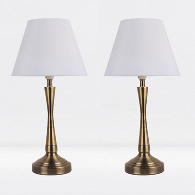 First Choice Lighting Set of 2 Antique Brass Plated Bedside Table Light with Curved Column White Fabric Shade