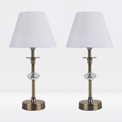 First Choice Lighting Set of 2 Antique Brass Plated Stacked Bedside Table Light Faceted Acrylic White Fabric Shade