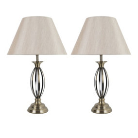First Choice Lighting Set of 2 Cigar Antique Brass 55cm Table Lamps with Off White Fabric Shades
