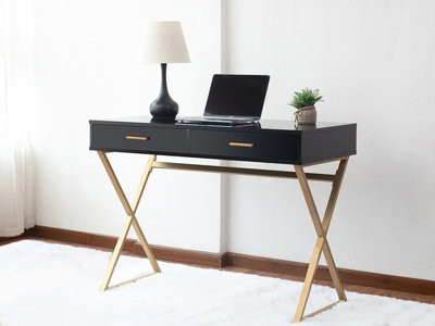 Black desk with gold outlet hardware