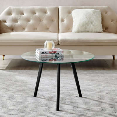 Round glass coffee table deals with wooden legs