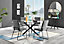 Furniturebox Novara Clear Tempered Glass 120cm Round Dining Table with Black Starburst Legs & 4 Dark Grey Halle Soft Fabric Chairs