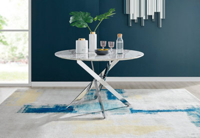 Furniturebox Novara White Marble Effect 120cm Round Dining Table with Chrome Starburst Legs & 6 White Faux Leather Milan Chairs