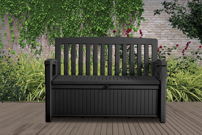 A garden storage bench with storage underneath the bench seat and a door on the front.