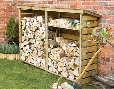 A timber log store with an open front, small pitched roof, and logs stored inside.