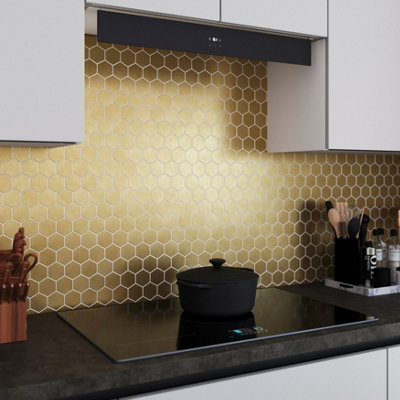 Gold effect mini hexagon tiled kitchen splashback.