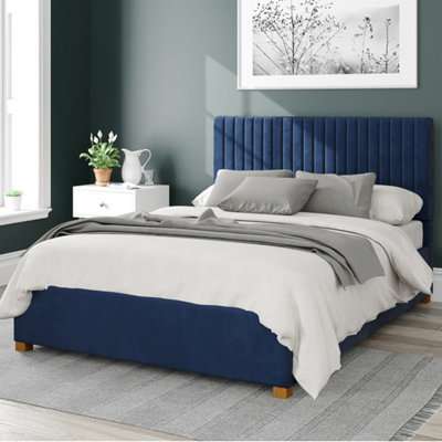 Navy blue upholstered clearance bed with storage