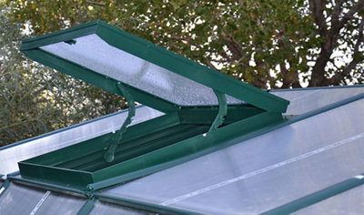 An open roof hatch on the top of an extruded resin frame greenhouse.