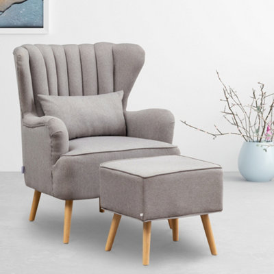 Grey arm chair with foot stool sale