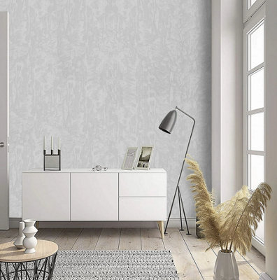 A white and grey living room with a grey plain embossed wallpaper feature wall, a white sideboard and light wooden flooring.