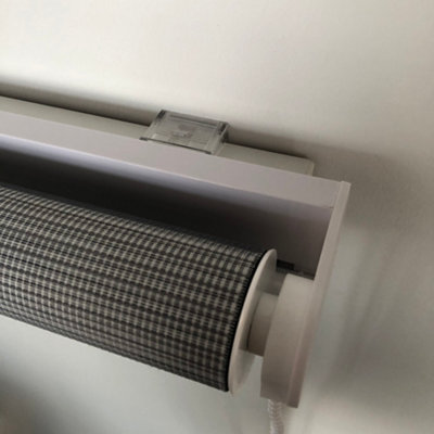 Grey roller blinds.