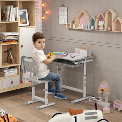 https://media.diy.com/is/image/KingfisherDigital/homcom-kids-desk-and-chair-set-adjustable-tiltable-w-drawer-pen-slot-hook~5056602965716_01c_MP?$MOB_PREV$&$width=618&$height=618