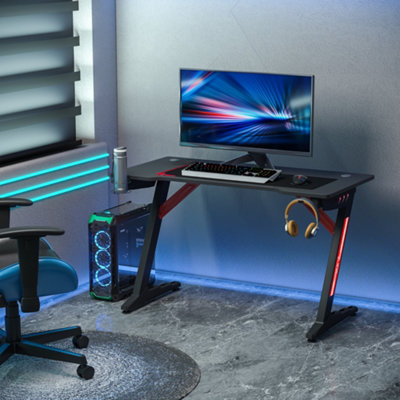 https://media.diy.com/is/image/KingfisherDigital/homcom-led-racing-style-gaming-desk-table-with-cup-holder-hook-cable-holes~5056534512675_01c_MP?$MOB_PREV$&$width=768&$height=768