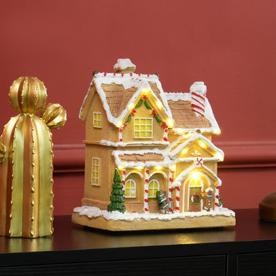 HOMCOM Lighted and Musical Christmas Candy House with Gingerbread Man Brown