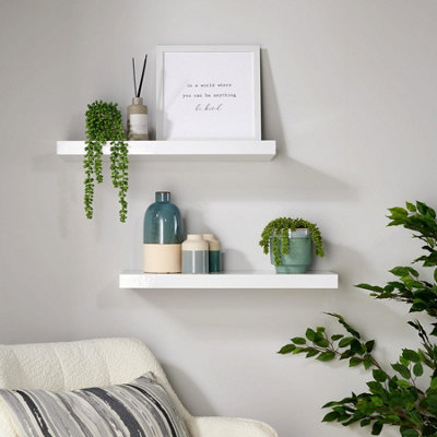 White gloss store floating shelves