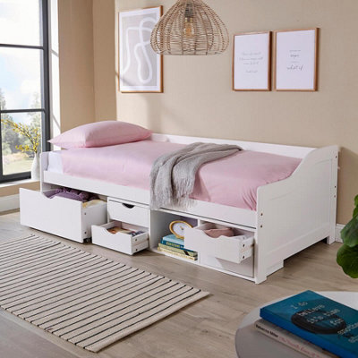 White wooden cabin store bed