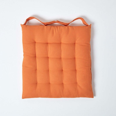 Homescapes Burnt Orange Plain Seat Pad with Button Straps 100% Cotton 40 x 40 cm
