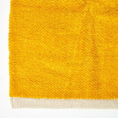 Homescapes Mustard 100% Cotton Plain Chenille Rug with Natural Trim, 90 x 150 cm