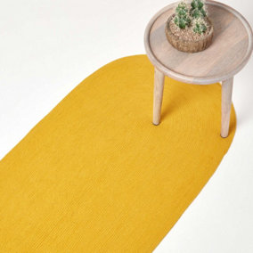 Homescapes Mustard Yellow Handmade Woven Braided Oval Hallway Rug, 66 x 200 cm
