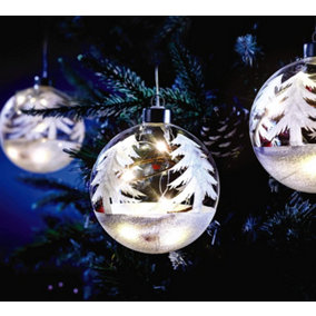 Illuminated Christmas Tree Bauble - 10cm Hand Painted Snow-covered Trees Glass Bauble Filled with LED Lights, Vine & Berries
