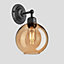 Industville Orlando Tinted Glass Globe Wall Light, 7 Inch, Amber, Pewter Holder