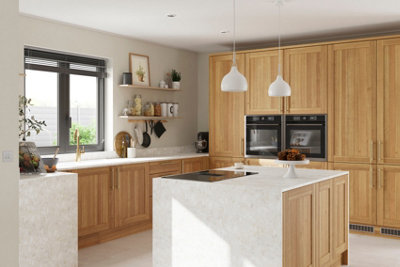 A large kitchen with wooden cabinetry, floating wooden shelves, white walls, white floor tiles, and white marble-effect worktops.