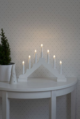 Konstsmide Welcome Light Candlestick wood matt white, 7 LED bulbs, 6xAA