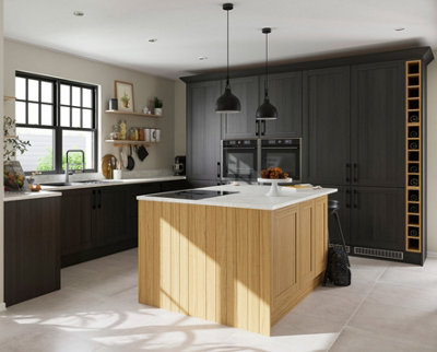 A large kitchen with black cabinetry and a large wooden island with white worktops.