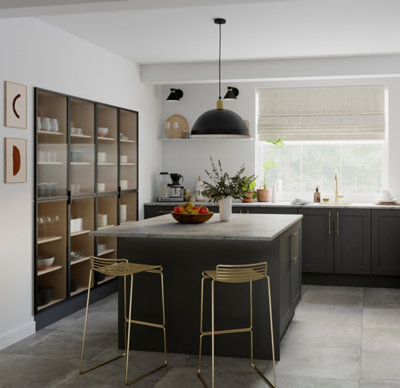 Large white and grey kitchen with a large island with grey cabinets and white marble worktop.