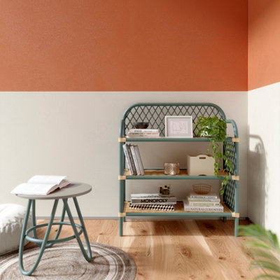 Light blue rattan bookshelf in a living room.