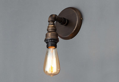 A traditional style wall hung light fitting with a traditional style filament bulb.