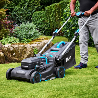 Someone cutting the grass with a Mac Allister  Cordless 38cm Push Lawnmower