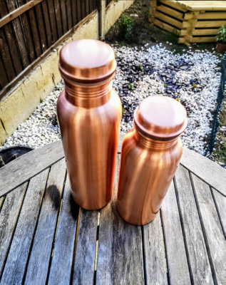 https://media.diy.com/is/image/KingfisherDigital/mantraraj-100-pure-copper-water-bottle-1-liter-34-oz-leak-proof-perfect-ayurvedic-copper-vessel-antique-water-bottle-plain-~5060913145224_06c_MP?$MOB_PREV$&$width=618&$height=618